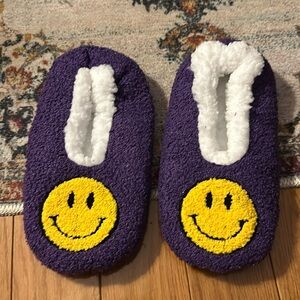 Purple smiley face slippers